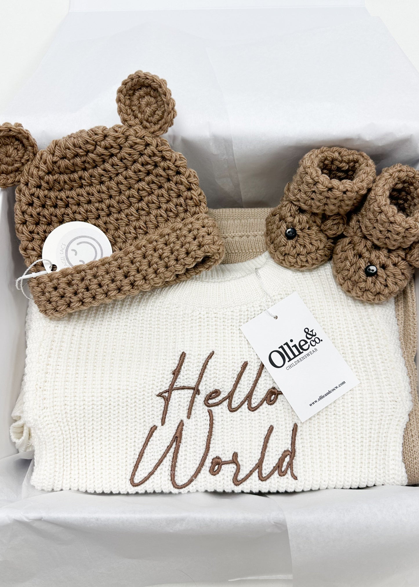 Baby hat and booties set with 'Hello World' blanket, Ollie's Baby brand visible