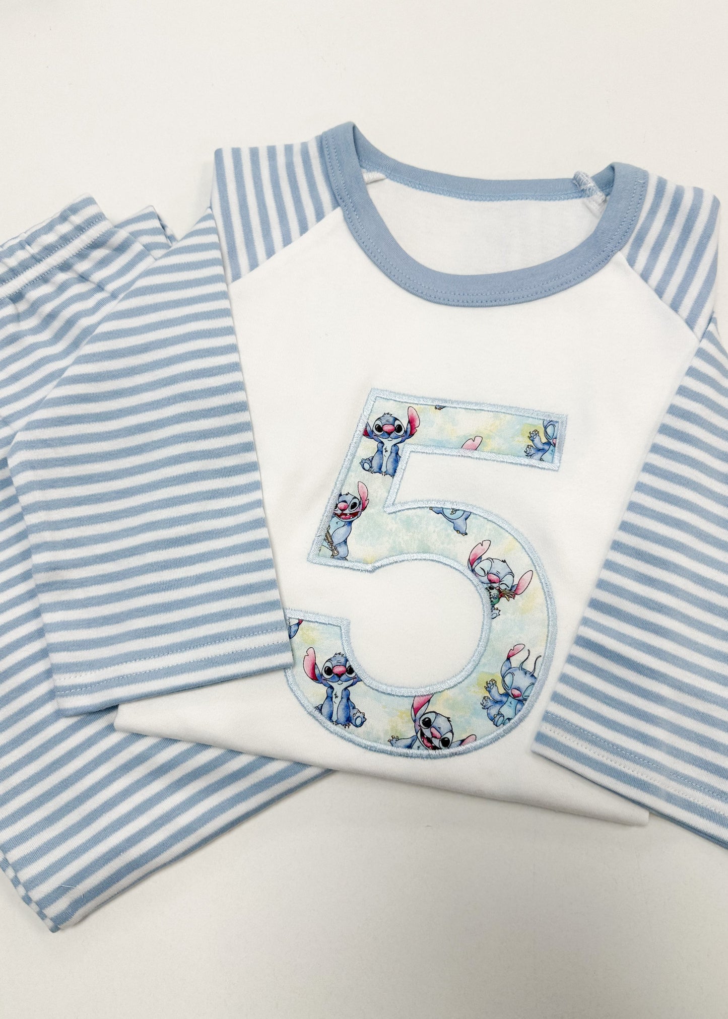 Children's pajama set with a number 5 design on a white background