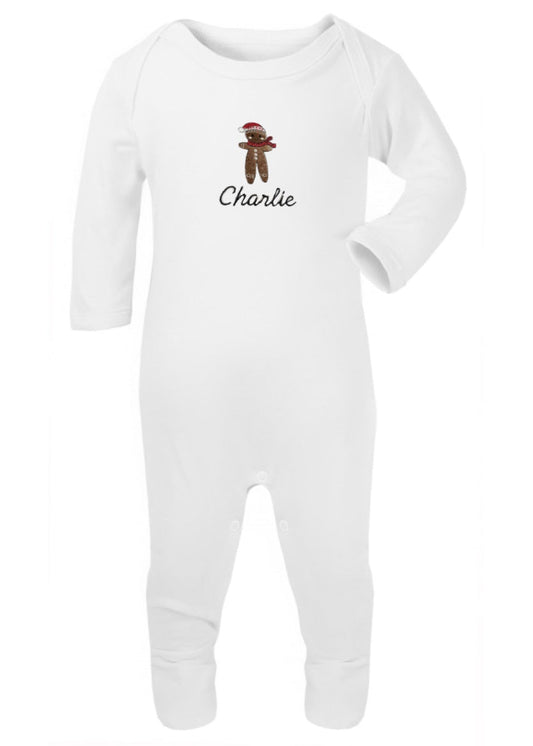 White long-sleeve romper with a graphic of a gingerbread man and the name 'Charlie' on the chest.