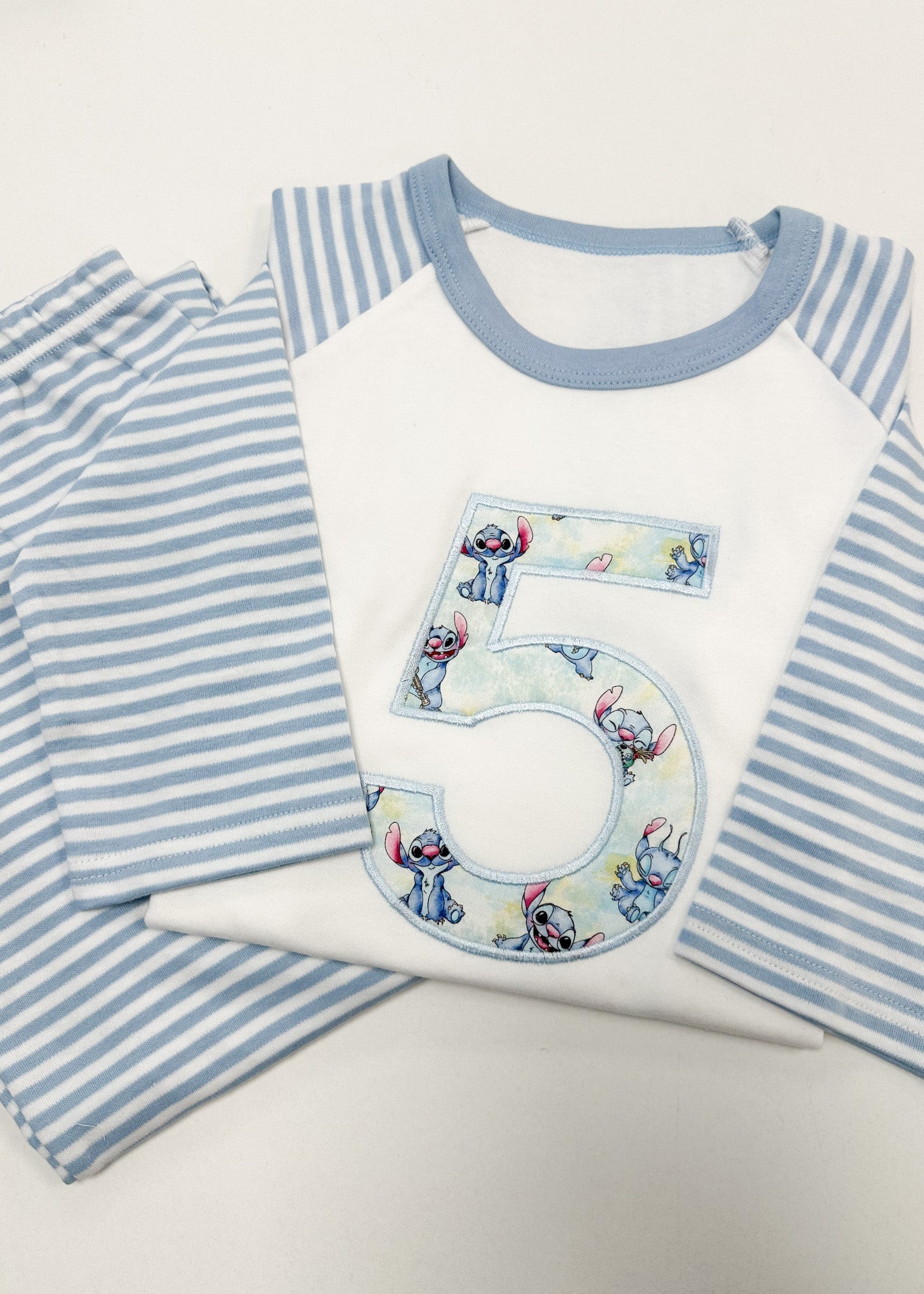 Children's pajama set with a number 5 design on a white background